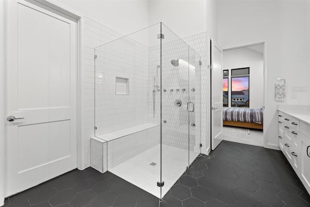 308 Rustling Wake Cv, Lakeway, TX 78738 - bathroom featuring a shower stall, tile patterned floors, ensuite bath, and vanity