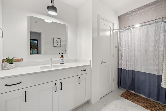 308 Rustling Wake Cv, Lakeway, TX 78738 - bathroom featuring vanity, tile patterned floors, and curtained shower