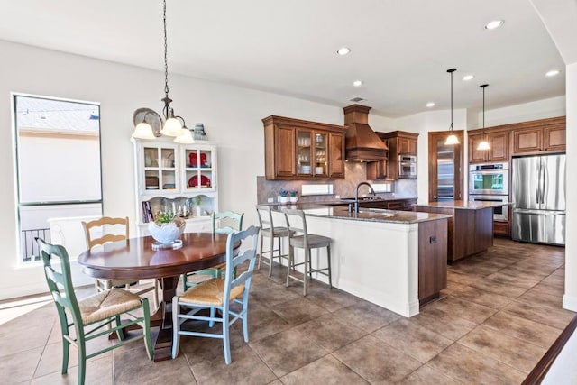 16216 Zagros Way, Austin, TX 78738 - dining area with recessed lighting, dark tile patterned floors, and arched walkways