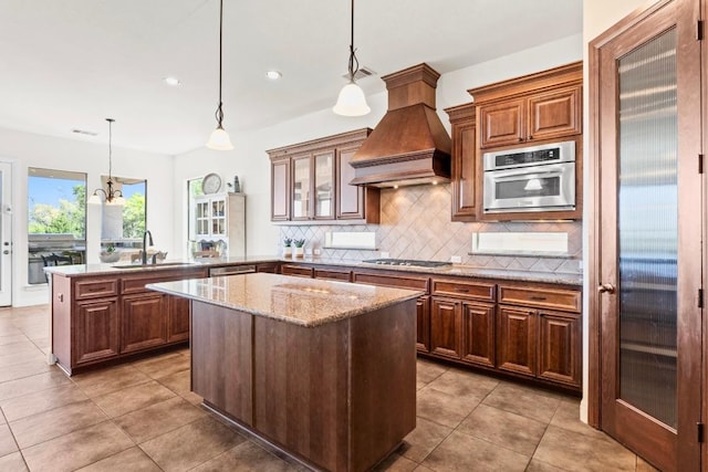 16216 Zagros Way, Austin, TX 78738 - kitchen featuring premium range hood, a peninsula, light tile patterned flooring, backsplash, and recessed lighting