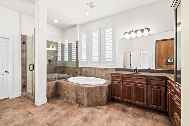 16216 Zagros Way, Austin, TX 78738 - full bathroom with a garden tub, vanity, a shower stall, and tile patterned flooring