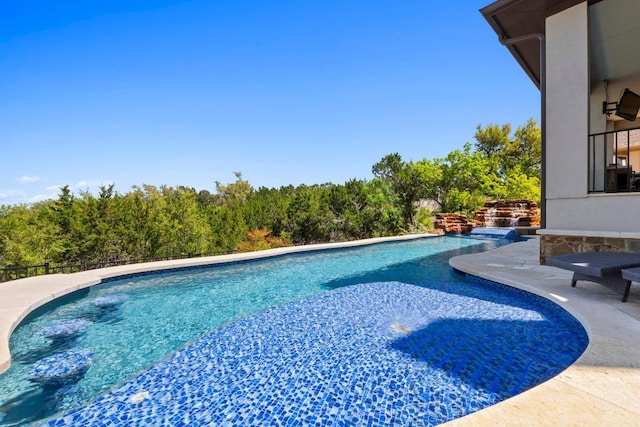 16216 Zagros Way, Austin, TX 78738 - outdoor pool featuring a patio and a view of trees