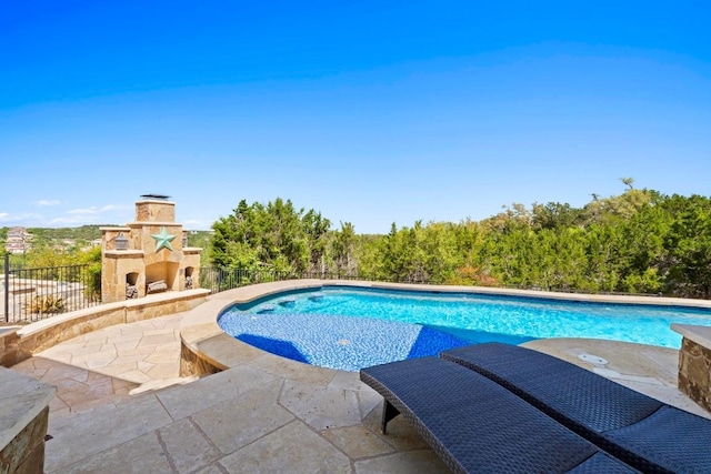 16216 Zagros Way, Austin, TX 78738 - view of swimming pool with an outdoor stone fireplace and a patio area