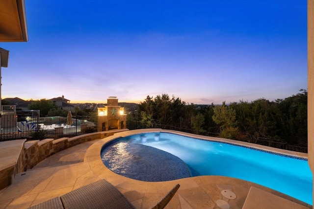 16216 Zagros Way, Austin, TX 78738 - pool at dusk featuring a patio area