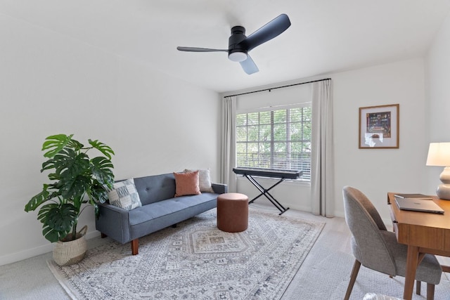 office with baseboards, a ceiling fan, and carpet flooring