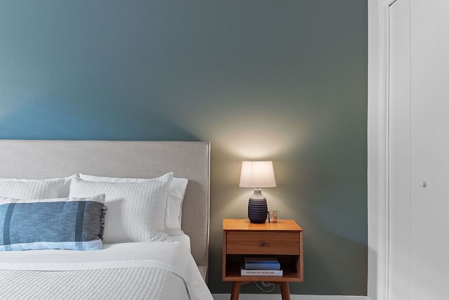 bedroom featuring baseboards