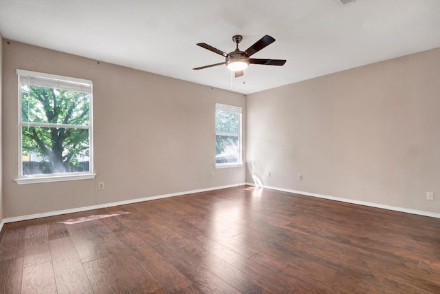 1415 Quicksilver Cir, Round Rock, TX 78665 - unfurnished room with a ceiling fan, dark wood-type flooring, and baseboards