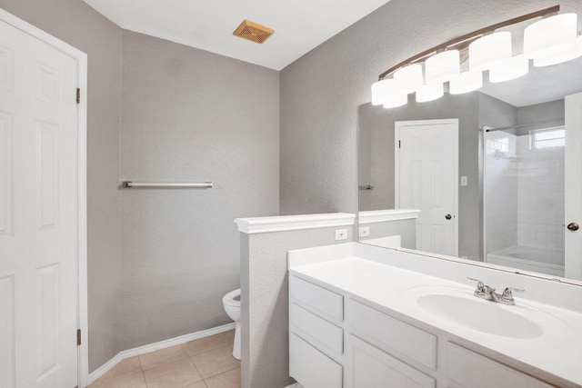 1415 Quicksilver Cir, Round Rock, TX 78665 - full bath featuring toilet, a textured wall, vanity, tile patterned floors, and baseboards