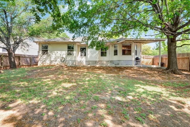 1415 Quicksilver Cir, Round Rock, TX 78665 - rear view of property featuring a fenced backyard and stucco siding