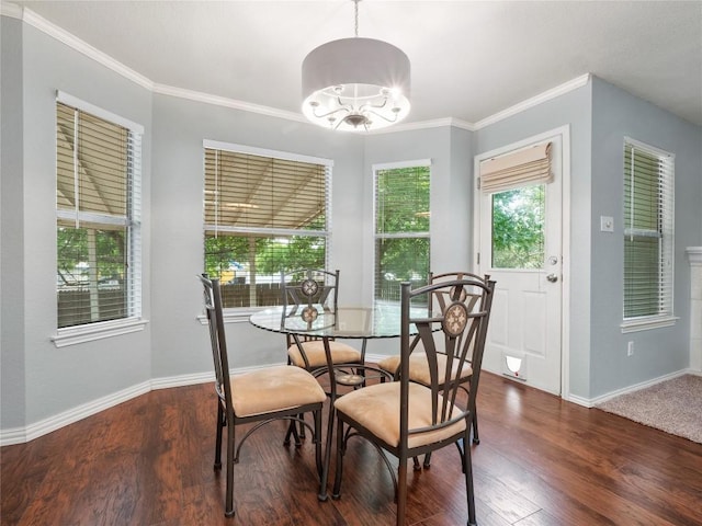 1415 Quicksilver Cir, Round Rock, TX 78665 - dining area with baseboards, dark wood-style flooring, a chandelier, and crown molding