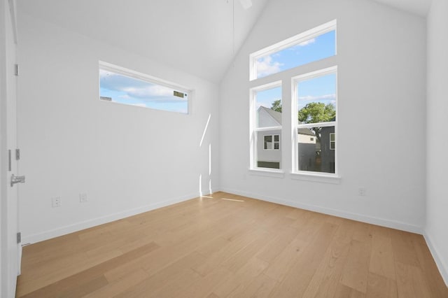 5107 Menchaca Rd Unit 9, Austin, TX 78745 - empty room with light wood-style floors and high vaulted ceiling