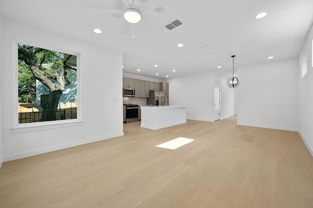 5107 Menchaca Rd Unit 9, Austin, TX 78745 - unfurnished living room with recessed lighting, light wood-style floors, and ceiling fan