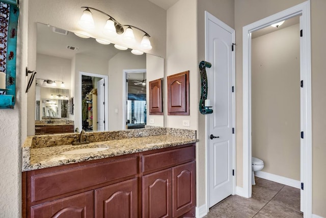 full bathroom featuring a closet, visible vents, toilet, and tile patterned floors