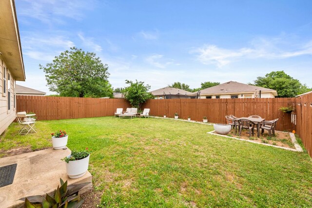 12616 Sky Harbor Dr, Del Valle, TX 78617 - view of yard featuring a patio and a fenced backyard