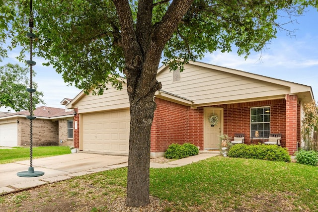 12616 Sky Harbor Dr, Del Valle, TX 78617 - view of front of house with concrete driveway, an attached garage, brick siding, and a front yard