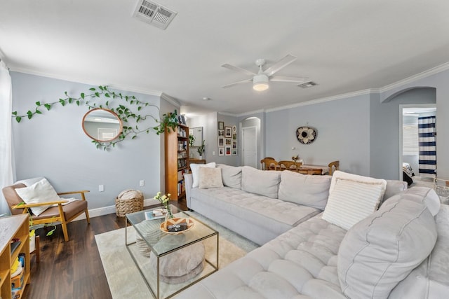 12616 Sky Harbor Dr, Del Valle, TX 78617 - living room with ceiling fan, arched walkways, crown molding, and visible vents