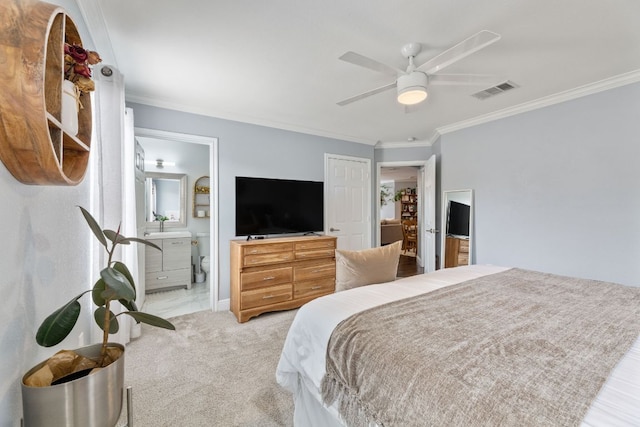 12616 Sky Harbor Dr, Del Valle, TX 78617 - bedroom featuring crown molding, ensuite bathroom, ceiling fan, light colored carpet, and visible vents