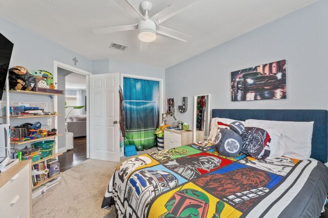 12616 Sky Harbor Dr, Del Valle, TX 78617 - bedroom featuring carpet floors, visible vents, and ceiling fan