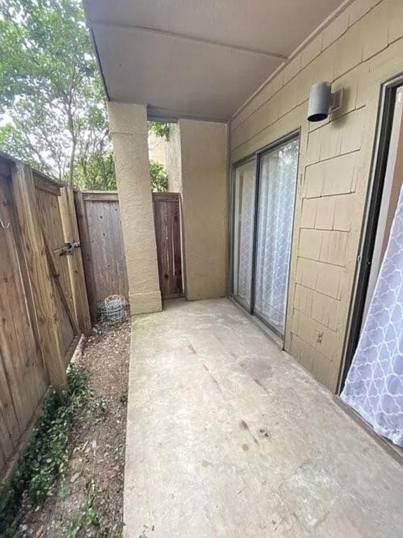 1202 Thorpe Ln Unit 211, San Marcos, TX 78666 - view of patio / terrace featuring fence