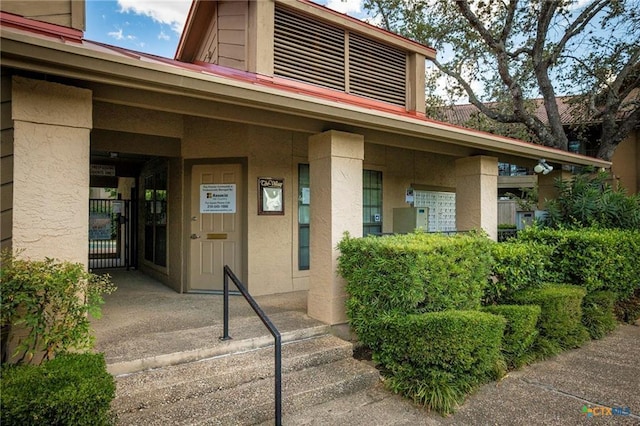 1202 Thorpe Ln Unit 211, San Marcos, TX 78666 - view of exterior entry featuring stucco siding