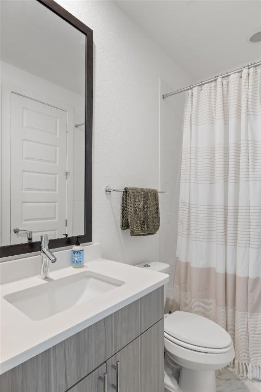 5368 Agatha Cir, Austin, TX 78724 - bathroom with vanity, toilet, and curtained shower
