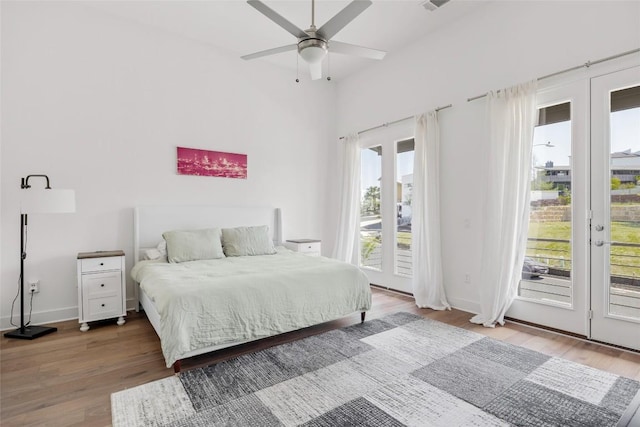 5368 Agatha Cir, Austin, TX 78724 - bedroom featuring access to outside, wood finished floors, baseboards, and a ceiling fan