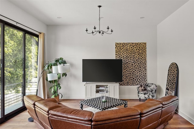 5368 Agatha Cir, Austin, TX 78724 - living room with a chandelier, baseboards, and wood finished floors