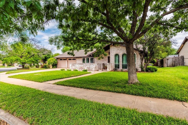 9011 W Pointer Ln, Austin, TX 78758 - view of front of property with an attached garage, driveway, and brick siding