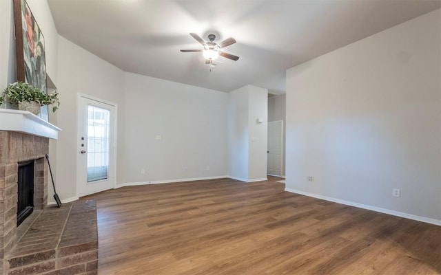208 Bastian Ln, Georgetown, TX 78626 - unfurnished living room with a fireplace, ceiling fan, wood finished floors, and baseboards