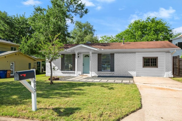 1603 Grayford Dr, Austin, TX 78704 - ranch-style home with a front lawn, brick siding, driveway, and a shingled roof