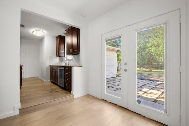 1603 Grayford Dr, Austin, TX 78704 - interior space with baseboards, visible vents, a sink, and light wood-style floors