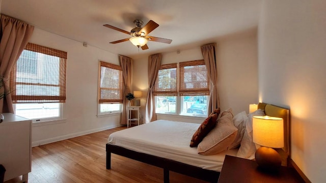 2102 E Martin Luther King Jr Blvd, Austin, TX 78702 - bedroom featuring wood finished floors, baseboards, and ceiling fan