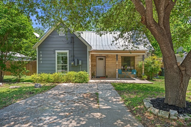 1503 Hart St, Georgetown, TX 78626 - view of front facade with a porch, a metal roof, and a standing seam roof