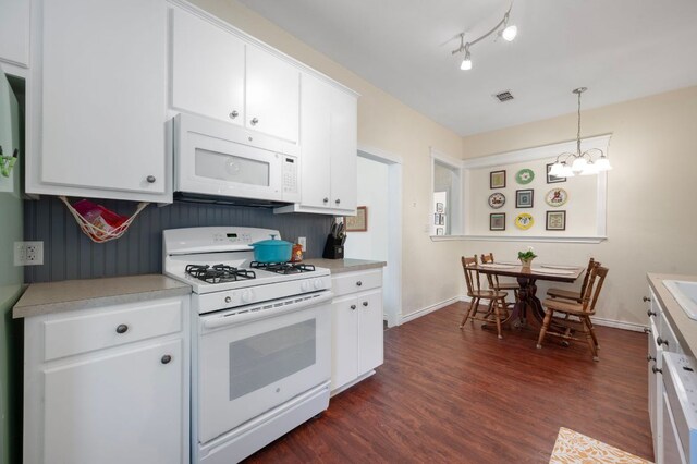 1503 Hart St, Georgetown, TX 78626 - kitchen featuring white appliances, light countertops, white cabinets, and dark wood-type flooring