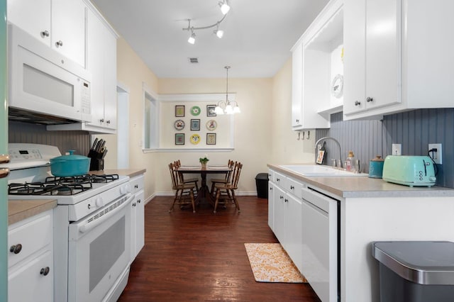 1503 Hart St, Georgetown, TX 78626 - kitchen with white appliances, a sink, dark wood-type flooring, and light countertops
