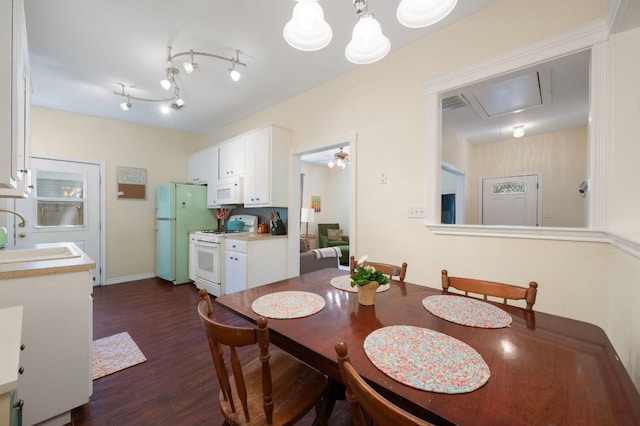 1503 Hart St, Georgetown, TX 78626 - dining area featuring attic access and dark wood-style floors