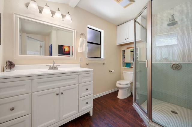 1503 Hart St, Georgetown, TX 78626 - full bathroom featuring wood finished floors, vanity, and a stall shower