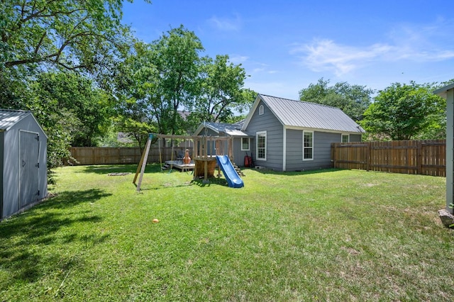1503 Hart St, Georgetown, TX 78626 - fenced backyard featuring a playground and a storage unit