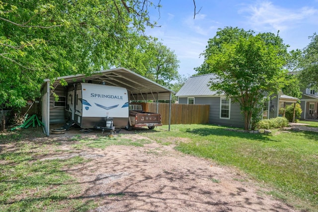 1503 Hart St, Georgetown, TX 78626 - view of yard featuring dirt driveway and a detached carport