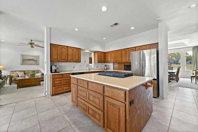 3225 Eisenhower Ave, Lago Vista, TX 78645 - kitchen with freestanding refrigerator, light carpet, light tile patterned floors, and recessed lighting