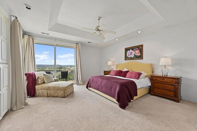 3225 Eisenhower Ave, Lago Vista, TX 78645 - bedroom with a raised ceiling, light carpet, access to outside, ceiling fan, and recessed lighting