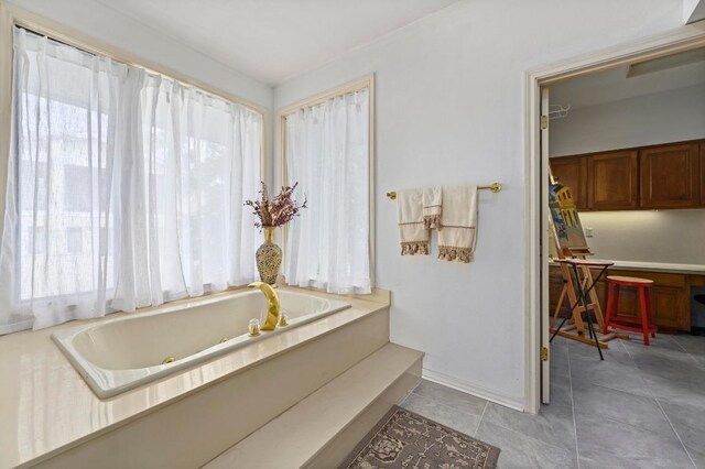 3225 Eisenhower Ave, Lago Vista, TX 78645 - bathroom with plenty of natural light, a whirlpool tub, baseboards, and tile patterned flooring