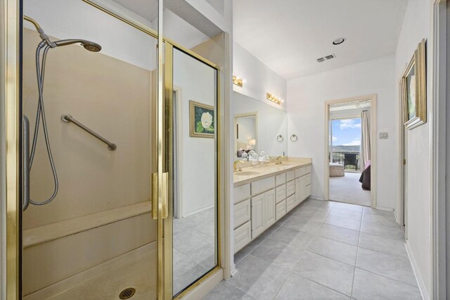3225 Eisenhower Ave, Lago Vista, TX 78645 - full bath with a shower stall, double vanity, and tile patterned flooring