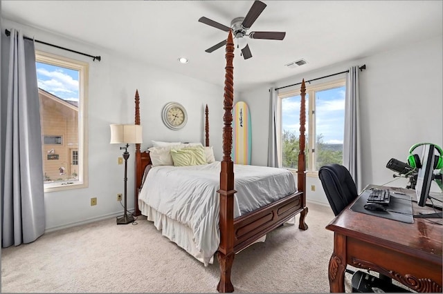 3225 Eisenhower Ave, Lago Vista, TX 78645 - bedroom with light colored carpet, a ceiling fan, baseboards, and an office area