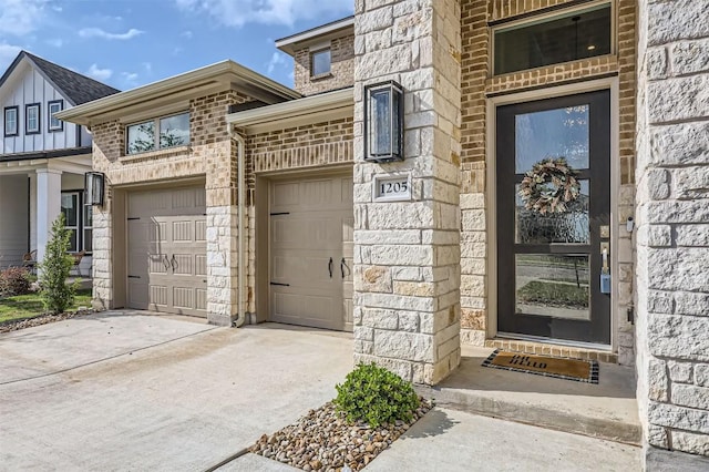 1205 Bluewood Bnd, Leander, TX 78641 - view of exterior entry featuring concrete driveway, stone siding, and brick siding