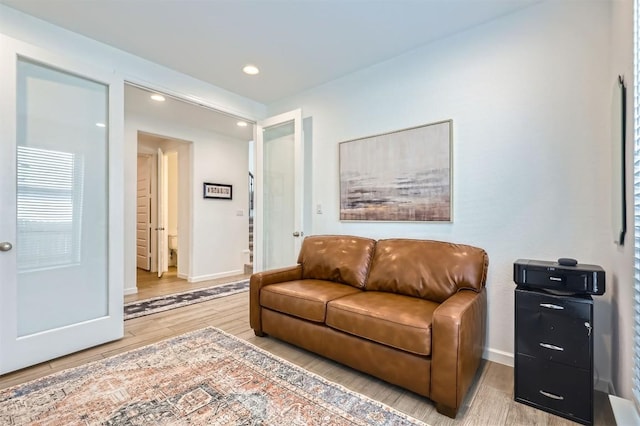 1205 Bluewood Bnd, Leander, TX 78641 - living room with baseboards, wood finished floors, and recessed lighting