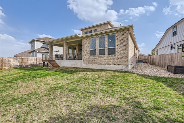1205 Bluewood Bnd, Leander, TX 78641 - rear view of house featuring brick siding and stairs