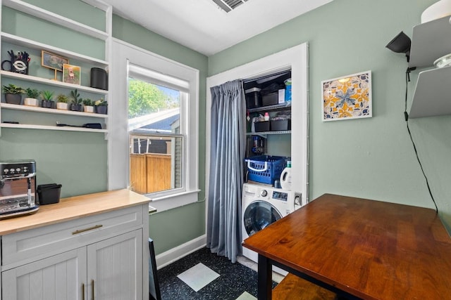 504 E 38th 1/2 St, Austin, TX 78751 - laundry room featuring baseboards, washer / dryer, and an office area