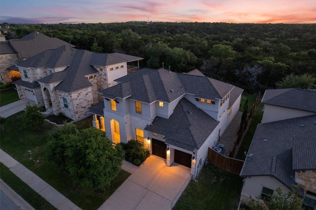3912 Logan Ridge Dr, Cedar Park, TX 78613 - aerial view at dusk featuring a view of trees and a residential view