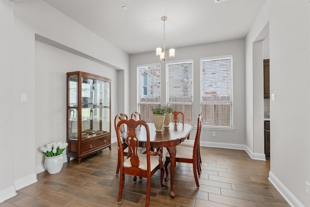 3912 Logan Ridge Dr, Cedar Park, TX 78613 - dining room featuring a healthy amount of sunlight, wood tiled floor, and baseboards